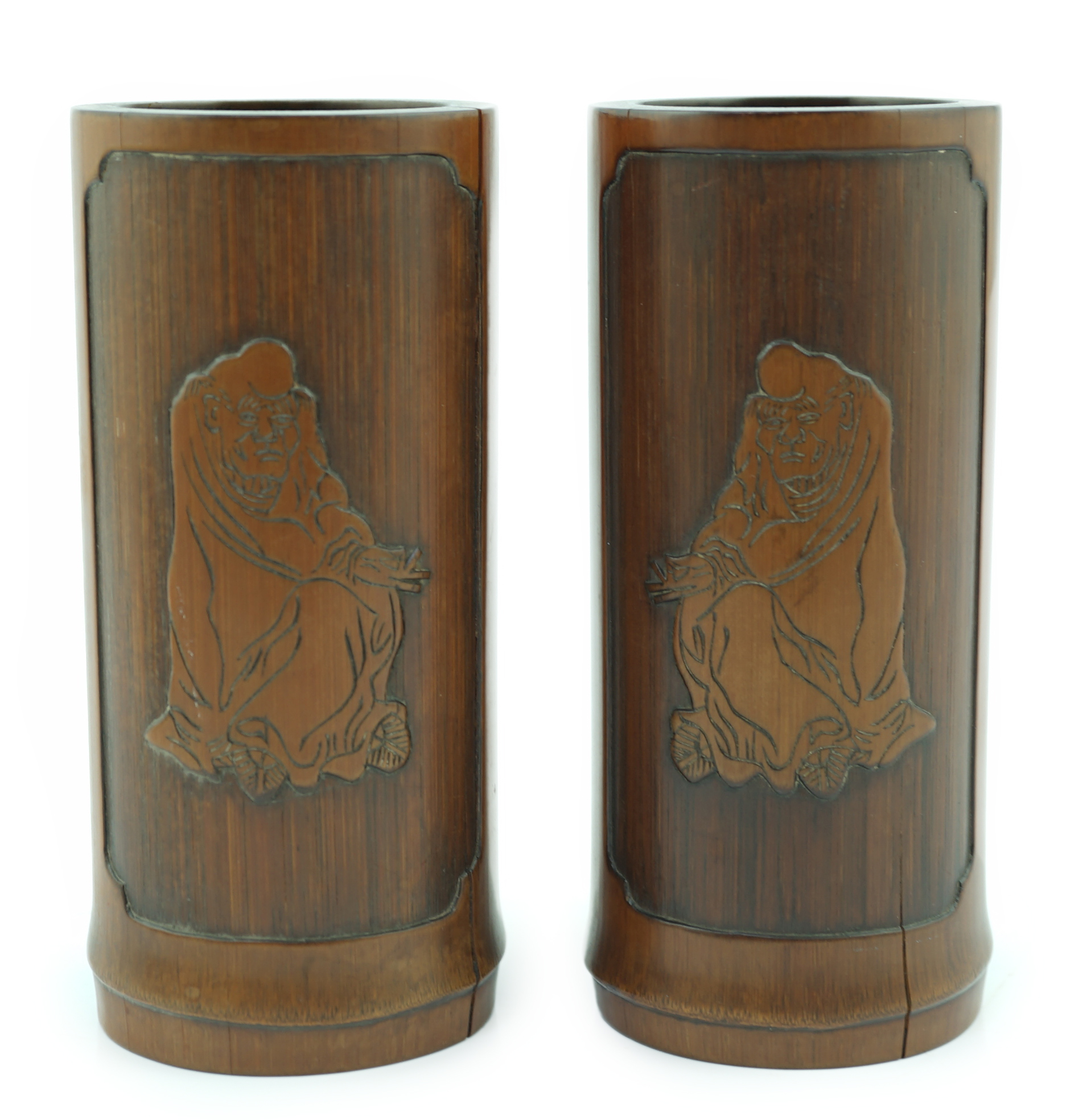 A pair of Chinese inscribed 'Damo' bamboo brushpots, 19th century, age cracks